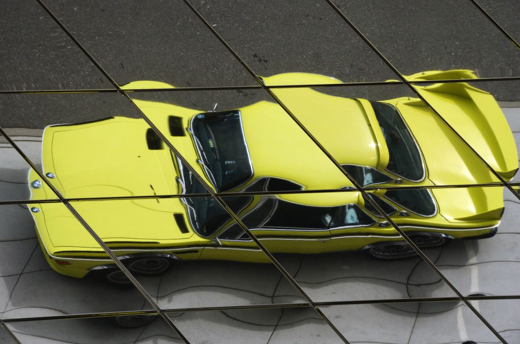 CSLreflectedinroofofporschemuseum.jpg